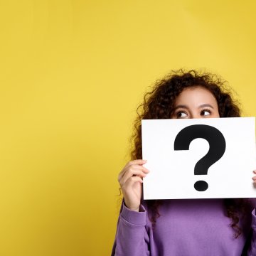 dvdfab dvd copy software woman holding question mark sign yellow background